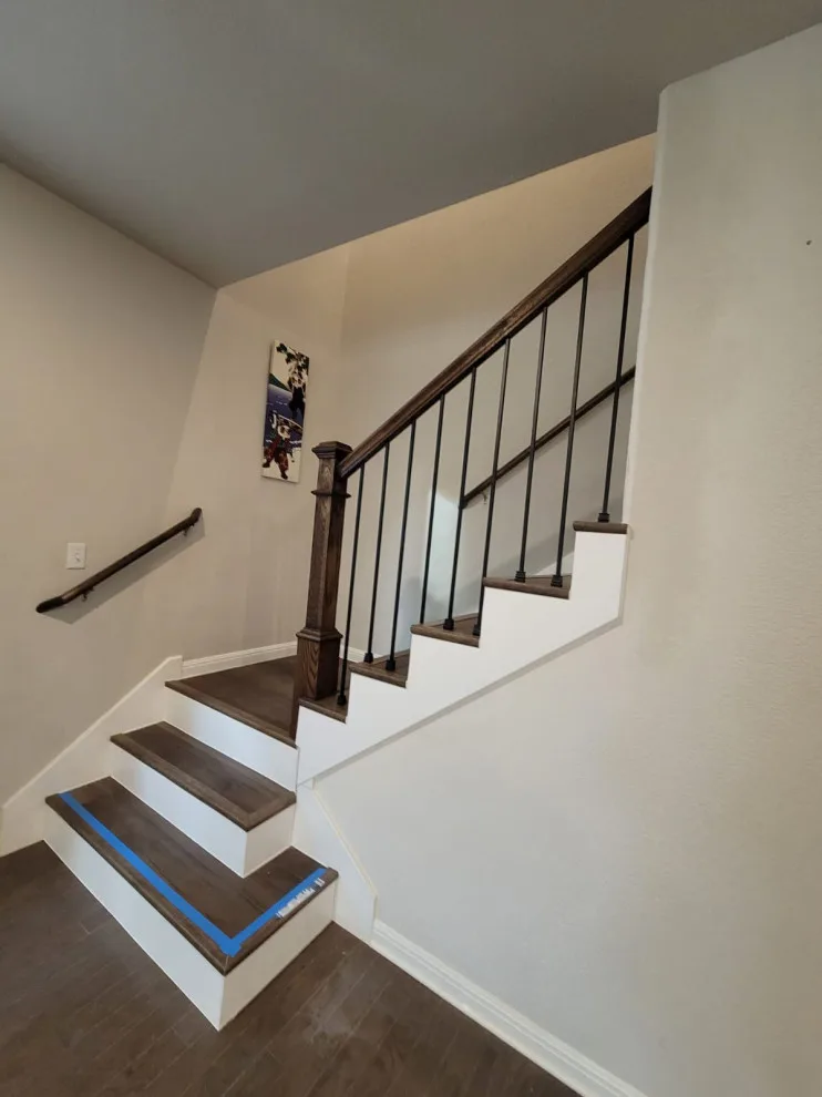 Fireplace and Staircase with New Flooring by Austin Dream Remodeling - Photo 5