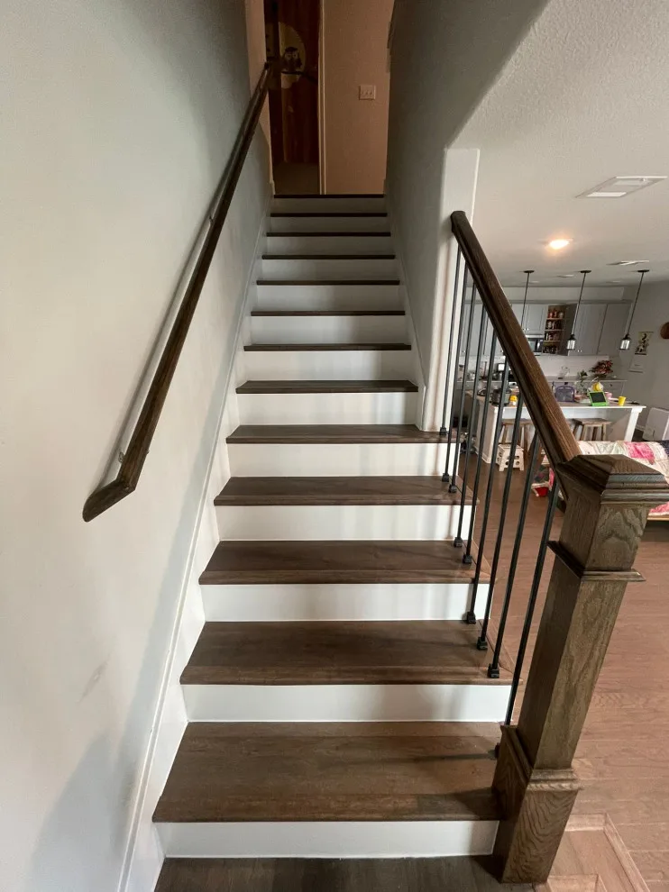 Fireplace and Staircase with New Flooring by Austin Dream Remodeling - Photo 8