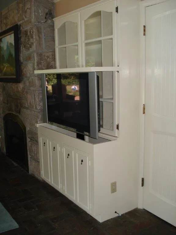 Automated Flatscreen Elevation System in Display Case by Sam Bradley Homes - Photo 2