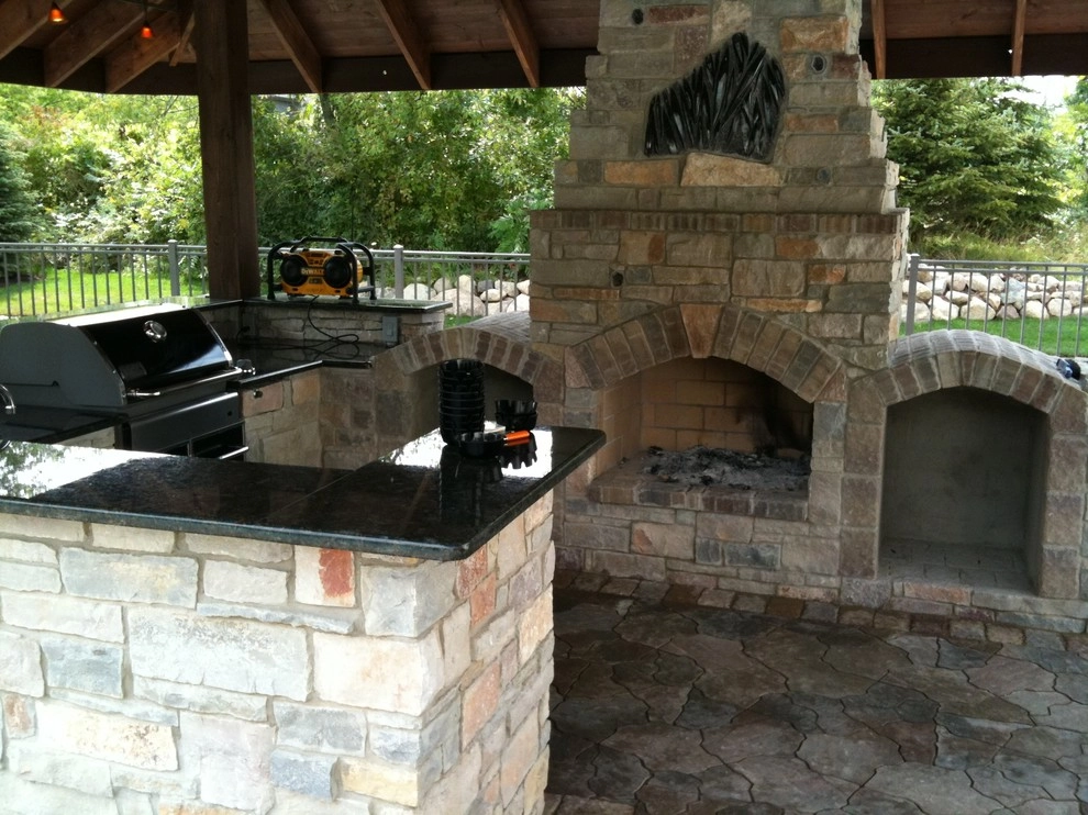 Outdoor Kitchen with fireplace by the pool by Apex Landscape And Brick Services LLC - Photo 8