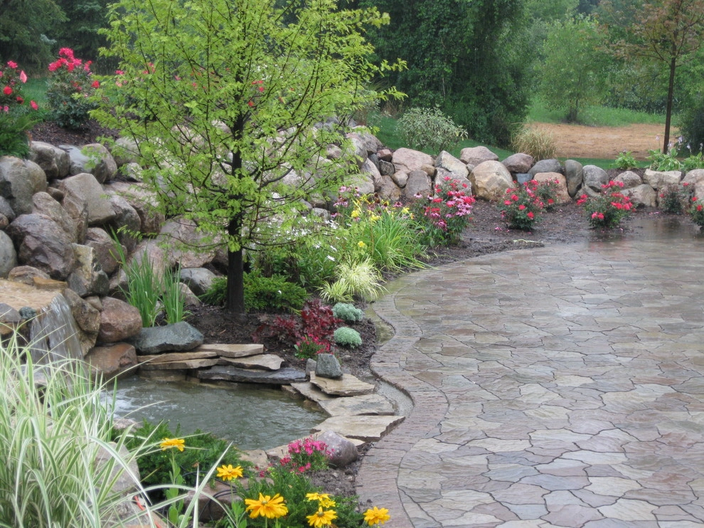 Outdoor Kitchen with fireplace by the pool by Apex Landscape And Brick Services LLC - Photo 4