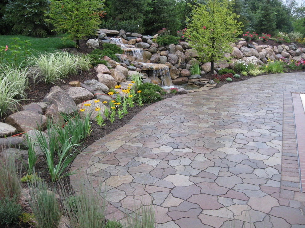 Outdoor Kitchen with fireplace by the pool by Apex Landscape And Brick Services LLC - Photo 5