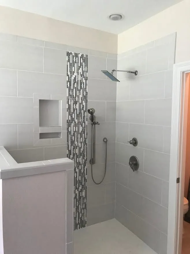 Shower Project with Gray Tile Design by Northshore Renovations - Photo 2