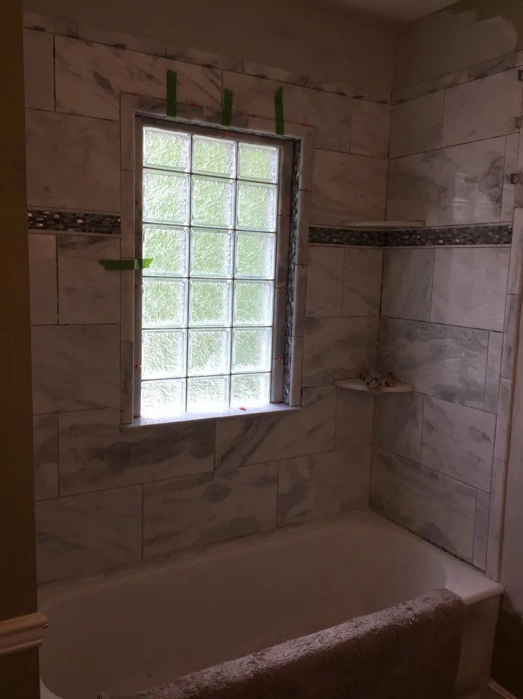 Bathroom with Window in Hall by Spencer Remodeling - Photo 12