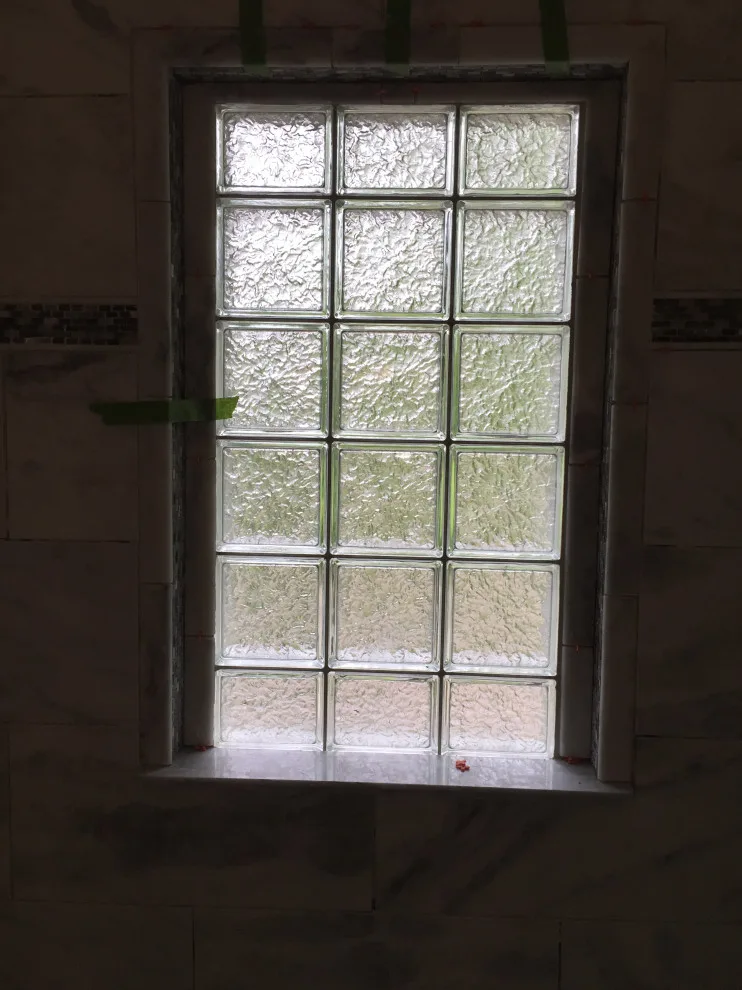 Bathroom with Window in Hall by Spencer Remodeling - Photo 17