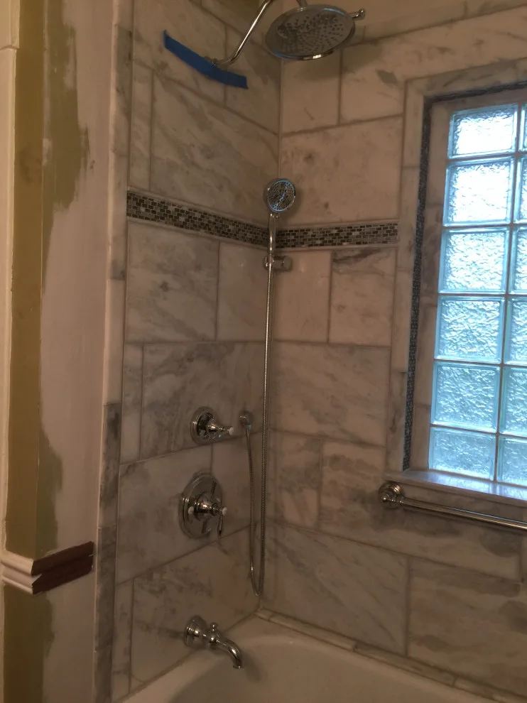 Bathroom with Window in Hall by Spencer Remodeling - Photo 15