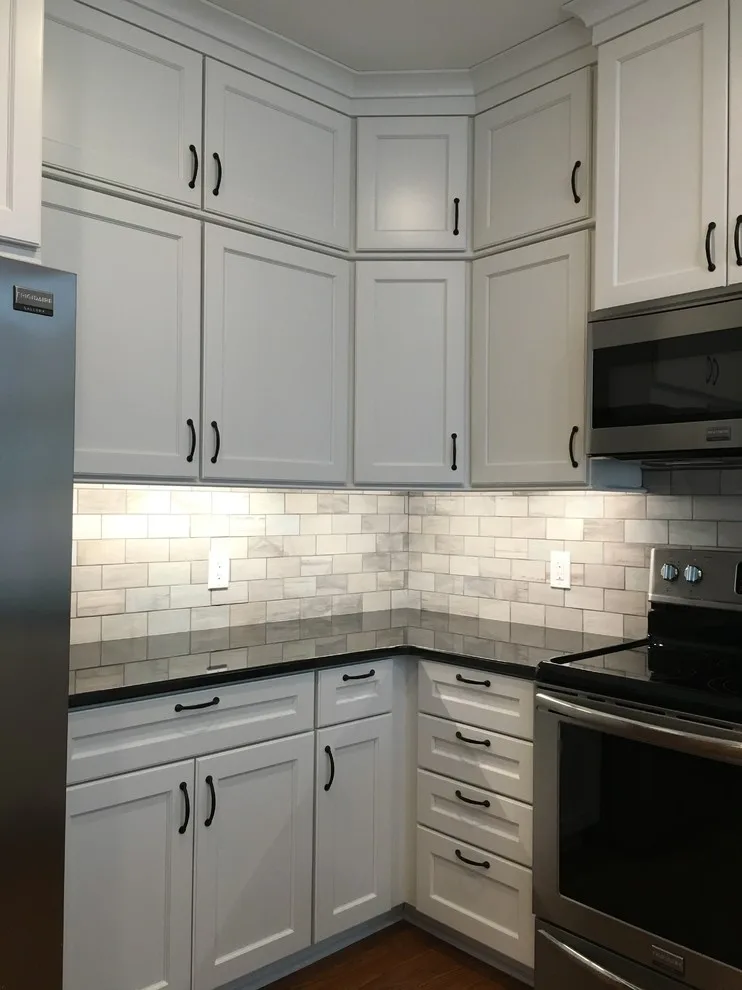 Monochrome Marietta Kitchen with Black Granite by Custom Professional Remodeling, Inc - Photo 11