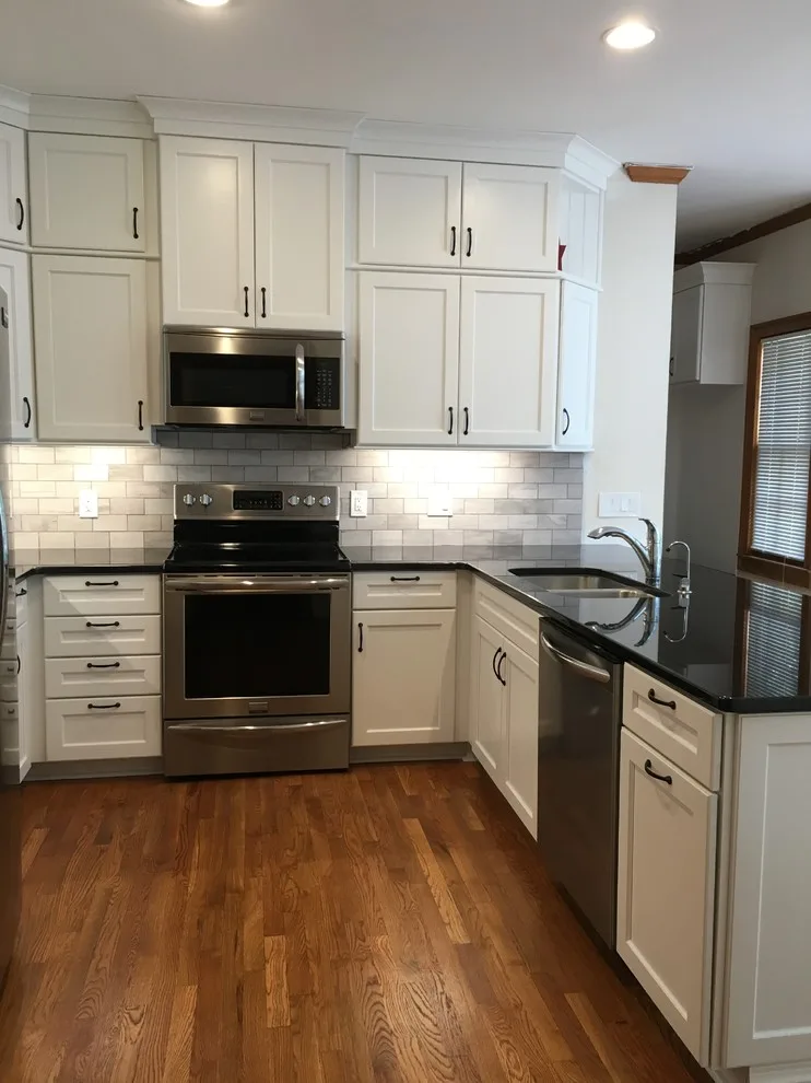 Monochrome Marietta Kitchen with Black Granite by Custom Professional Remodeling, Inc - Photo 5