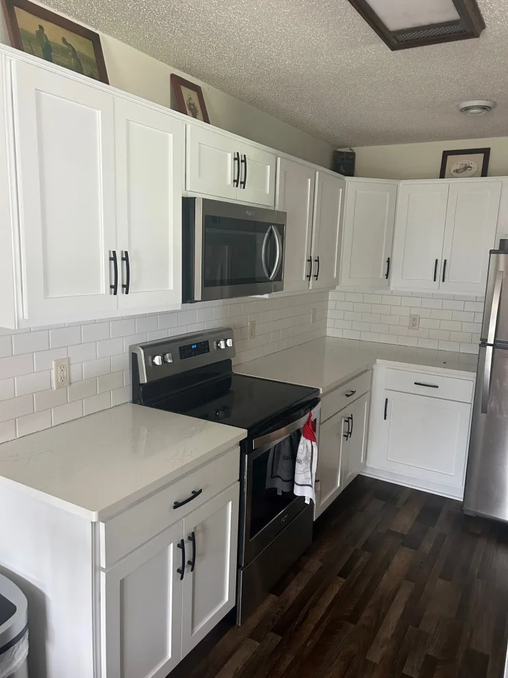 Kitchen Renovation with White Refaced Cabinets and Quartz Countertops by Kitchen Solvers Of Eau Claire - Photo 4