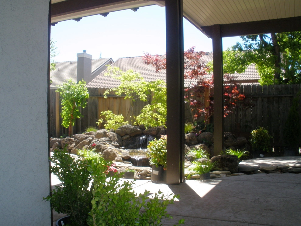 Rocklin Waterfall and Creek Running Through Patio by Bluestar Landscape Designers - Photo 3