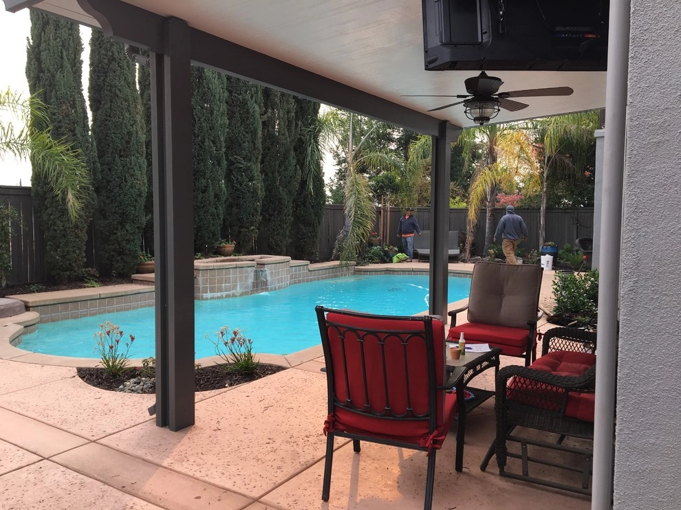 Creating shady seating areas around an existing pool by Bluestar Landscape Designers - Photo 2