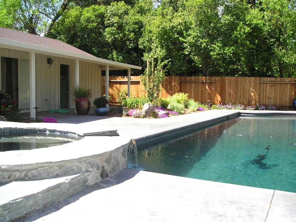 Pool with spa and waterfall by Bluestar Landscape Designers - Photo 3