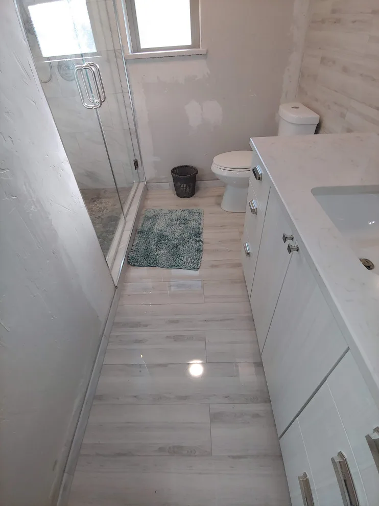 Modern Bathroom Transformation by Complete Home Remodel & Renovation Llc. - Photo 11