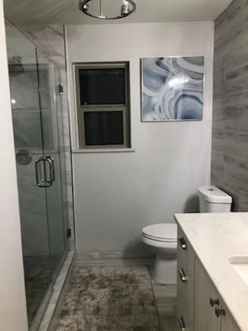 Modern Bathroom Transformation by Complete Home Remodel & Renovation Llc. - Photo 5