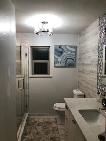Modern Bathroom Transformation by Complete Home Remodel & Renovation Llc. - Photo 8