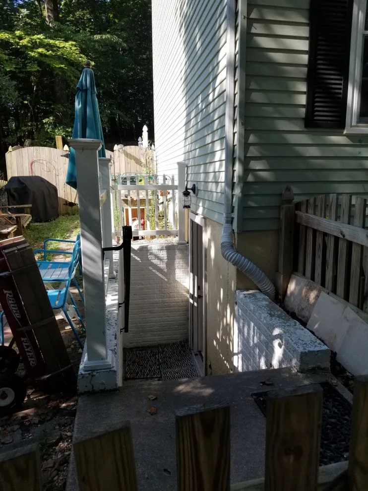 Porch with Breezeway Leading to Basement by Vm Home Improvement LLC - Photo 15