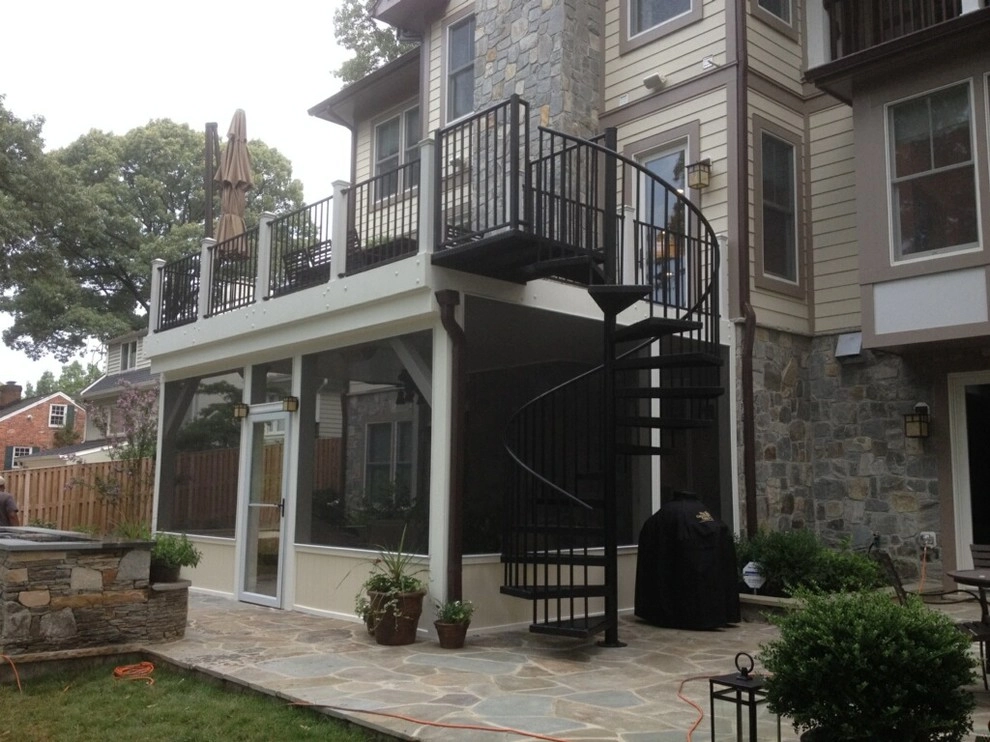 Flagstone Patio and deck with spiral staircase by Classic Stonescaping & Gardens - Photo 2