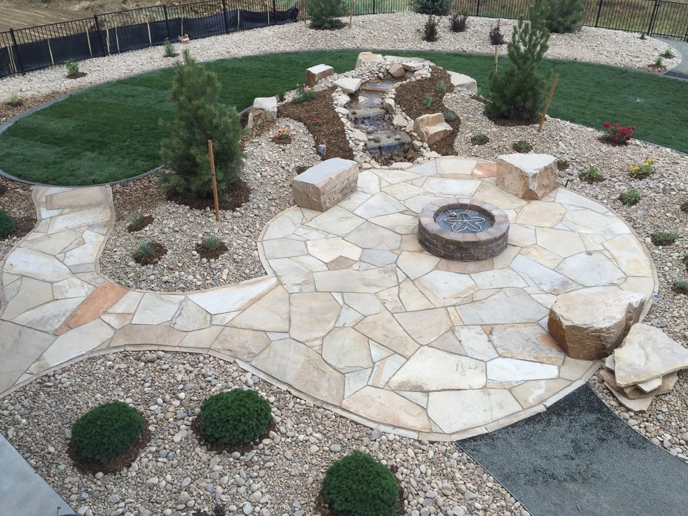 Flagstone Patio, Seat Boulders, Water Feature and Fire Pit; Windsor, CO 2016 by Colorado Vista Landscape Design, Inc. - Photo 3