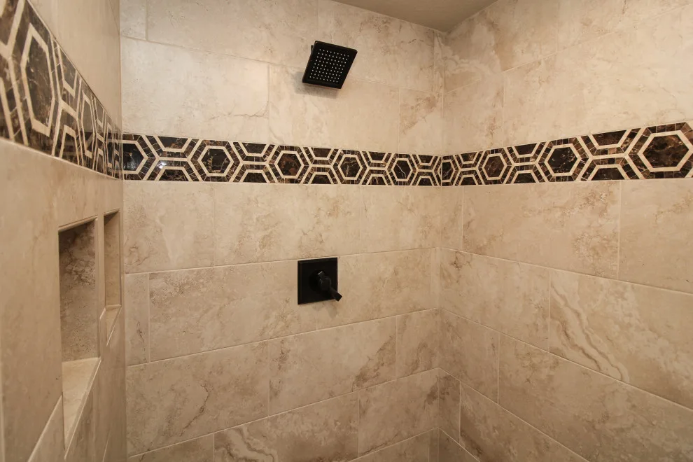Cozy Home Featuring Marble Countertops and Tiled Shower by H.J. Martin And Son - Photo 5