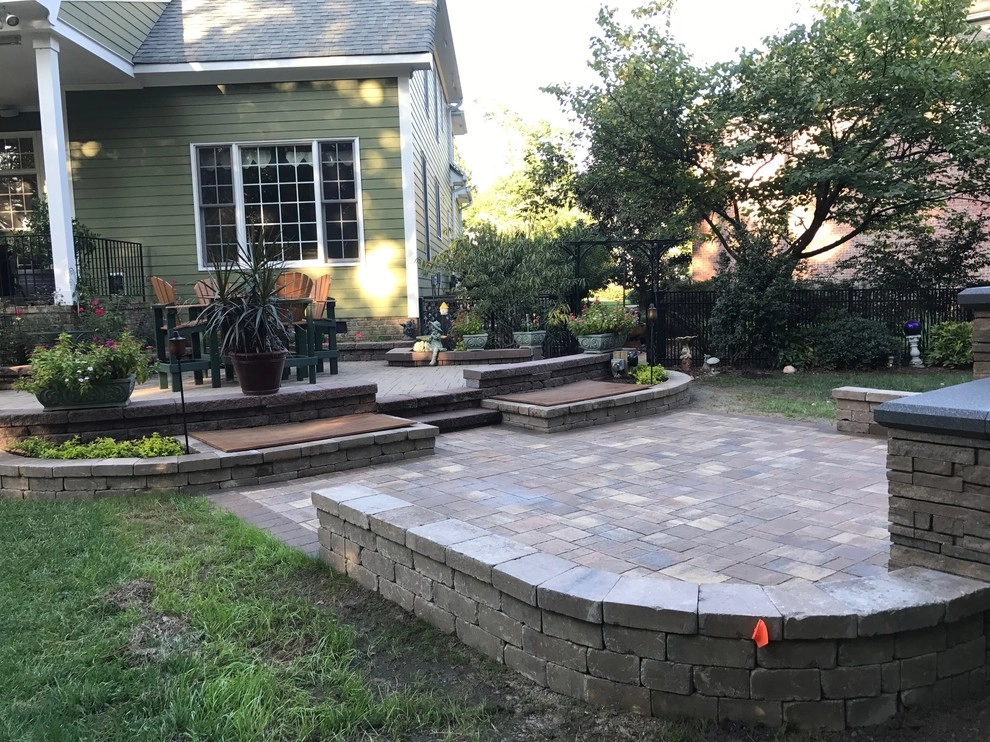 Patio With Water Features and Fireplace by Dreamscape Designers Landscape Company - Photo 2