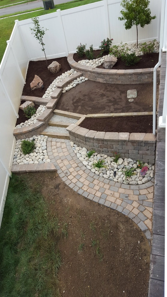 Retaining Wall with a Walkway and Patio by Dreamscape Designers Landscape Company - Photo 5