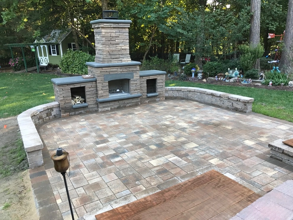 Patio With Water Features and Fireplace by Dreamscape Designers Landscape Company - Photo 4