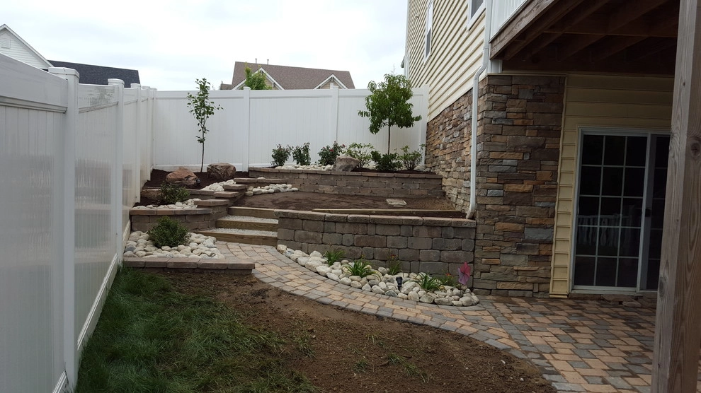 Retaining Wall with a Walkway and Patio by Dreamscape Designers Landscape Company - Photo 4