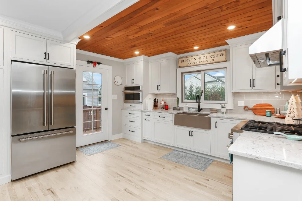 A Festive Coastal Kitchen by Baine Contracting, Inc. - Photo 25