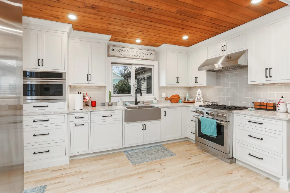 A Festive Coastal Kitchen by Baine Contracting, Inc. - Photo 15