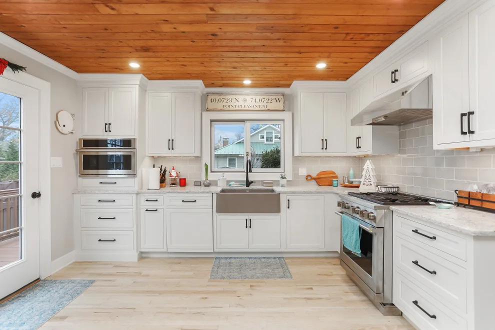 A Festive Coastal Kitchen by Baine Contracting, Inc. - Photo 14