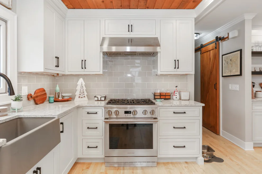 A Festive Coastal Kitchen by Baine Contracting, Inc. - Photo 7