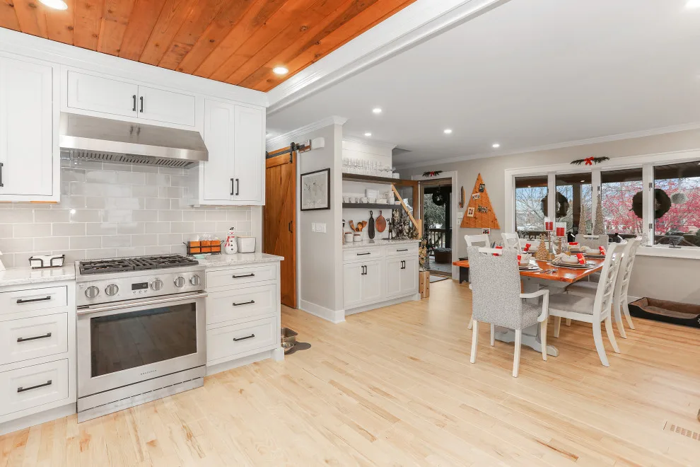 A Festive Coastal Kitchen by Baine Contracting, Inc. - Photo 11