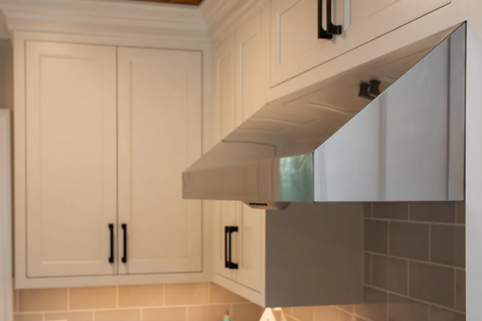 A Festive Coastal Kitchen by Baine Contracting, Inc. - Photo 35