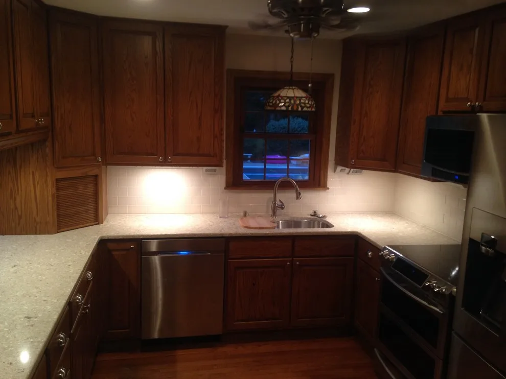 Classic Kitchen with Sleek Backsplash by In A Week. Guaranteed - Photo 2