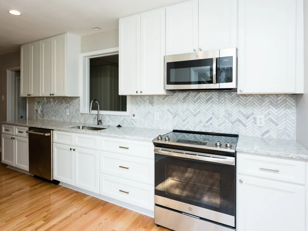 Classic White Kitchen and Bathroom in St. Louis by More For Less Remodeling - Photo 2