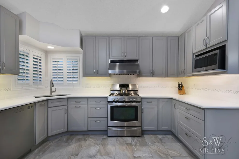 modern kitchen featuring gray cabinetry by Laura Scott - S & W Kitchens - Photo 3