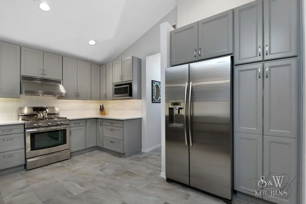 modern kitchen featuring gray cabinetry by Laura Scott - S & W Kitchens - Photo 2