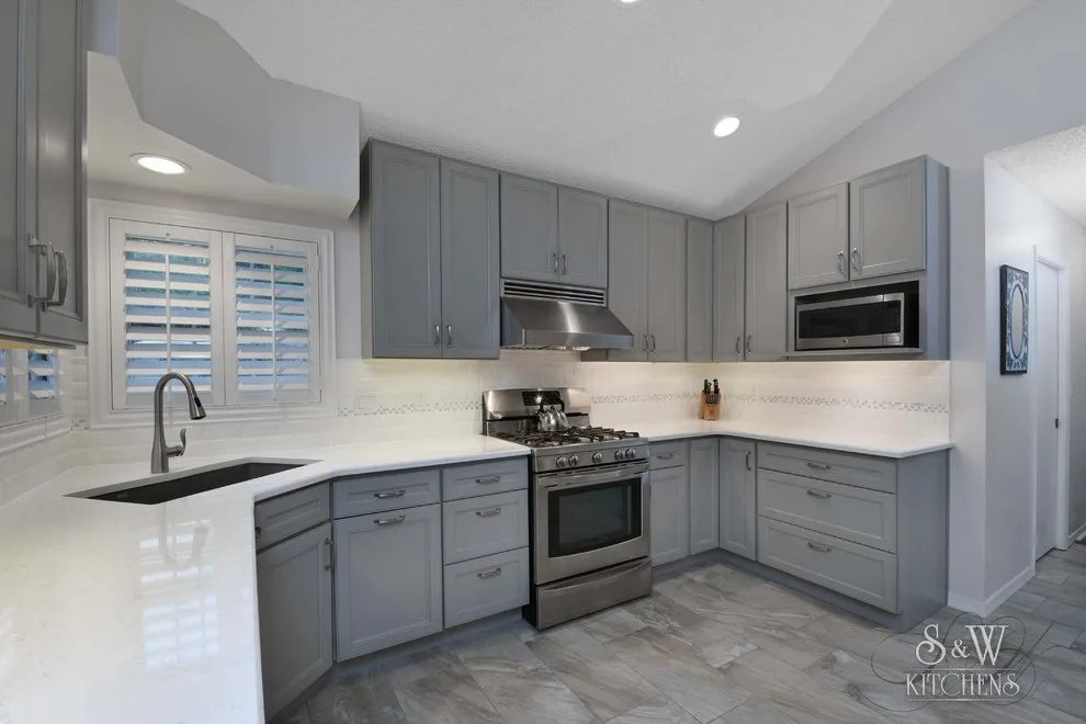 modern kitchen featuring gray cabinetry by Laura Scott - S & W Kitchens - Photo 6