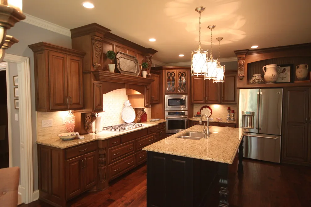 Cozy Cherry Kitchen Featuring a Black Island by Walters Cabinets, Inc. - Photo 2