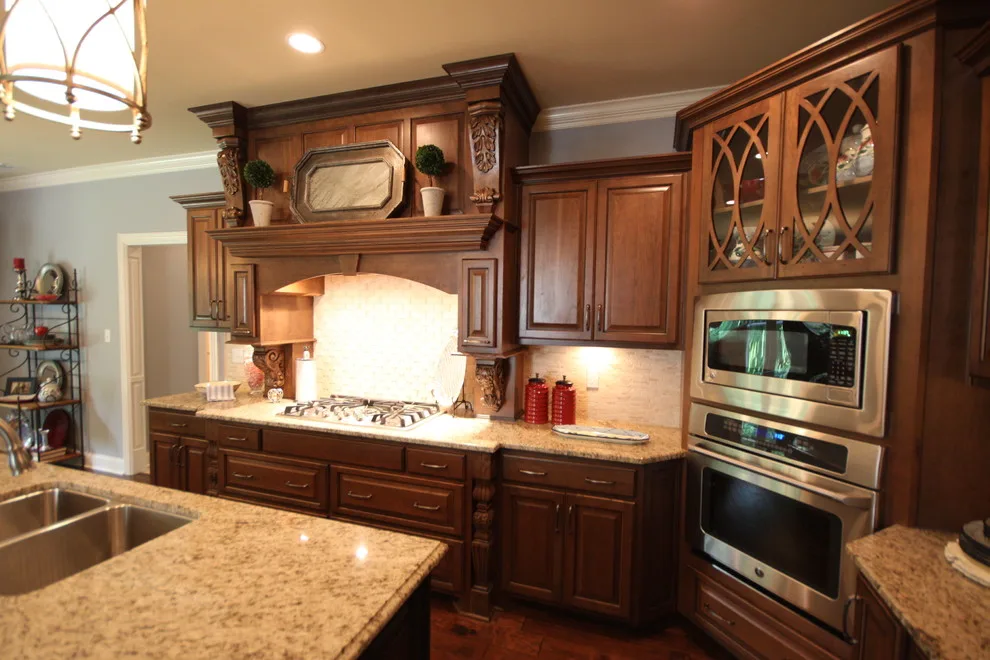 Cozy Cherry Kitchen Featuring a Black Island by Walters Cabinets, Inc. - Photo 3