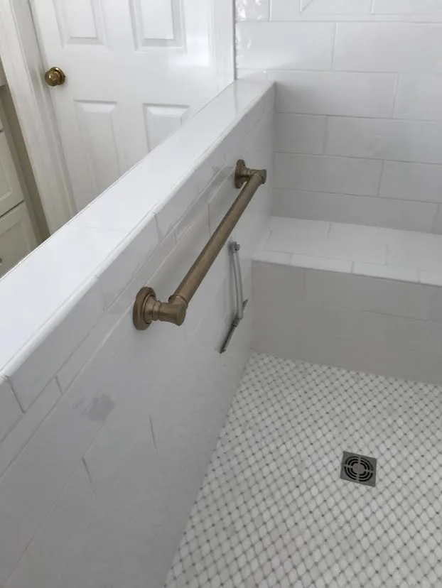Light-Colored Bathroom - Shower and Bathtub by Northshore Renovations - Photo 9