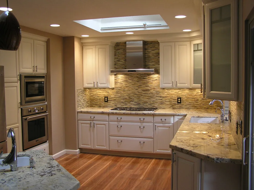 Kitchen with White Cabinets by SBC Contractors - Photo 2