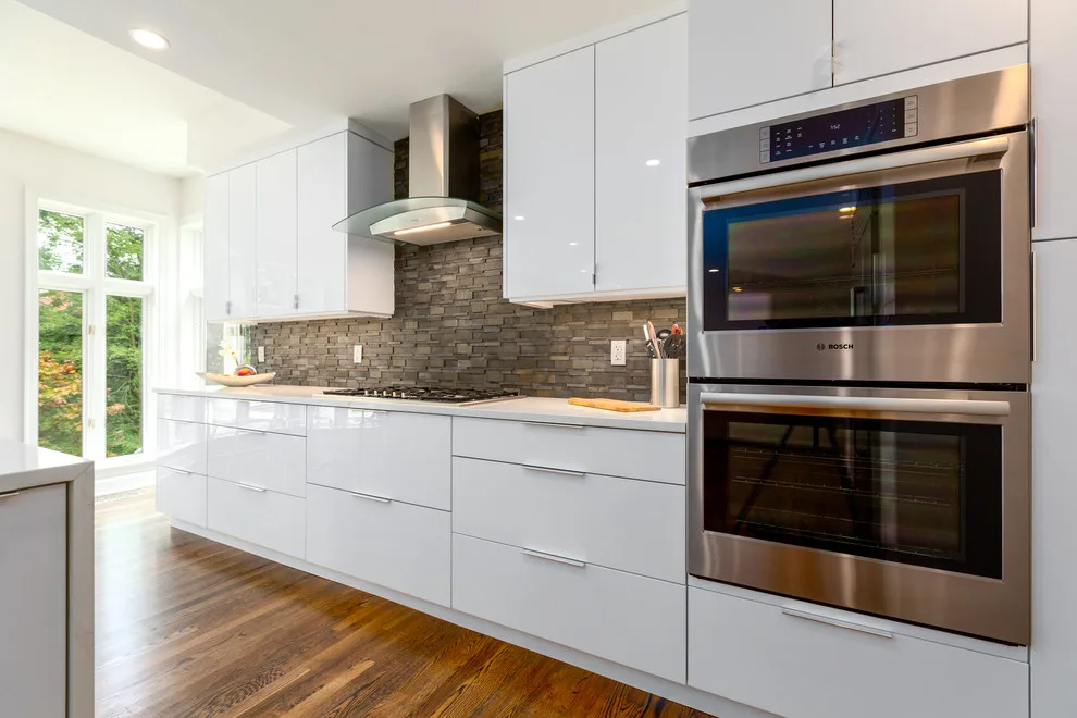 Glossy White Cabinets with White Countertop by Boss Design Center - Photo 14