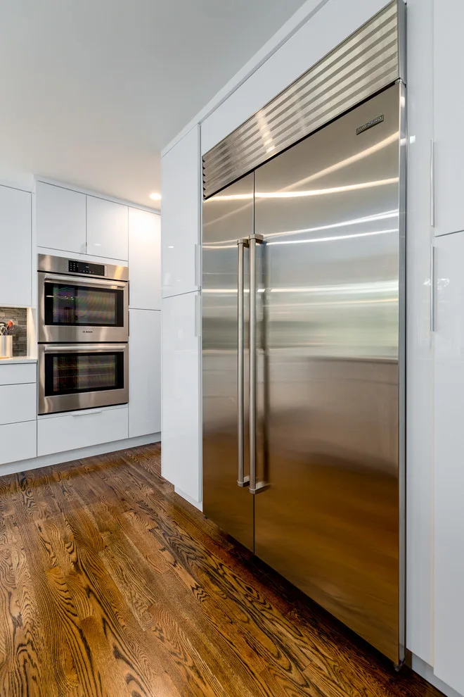 Glossy White Cabinets with White Countertop by Boss Design Center - Photo 10