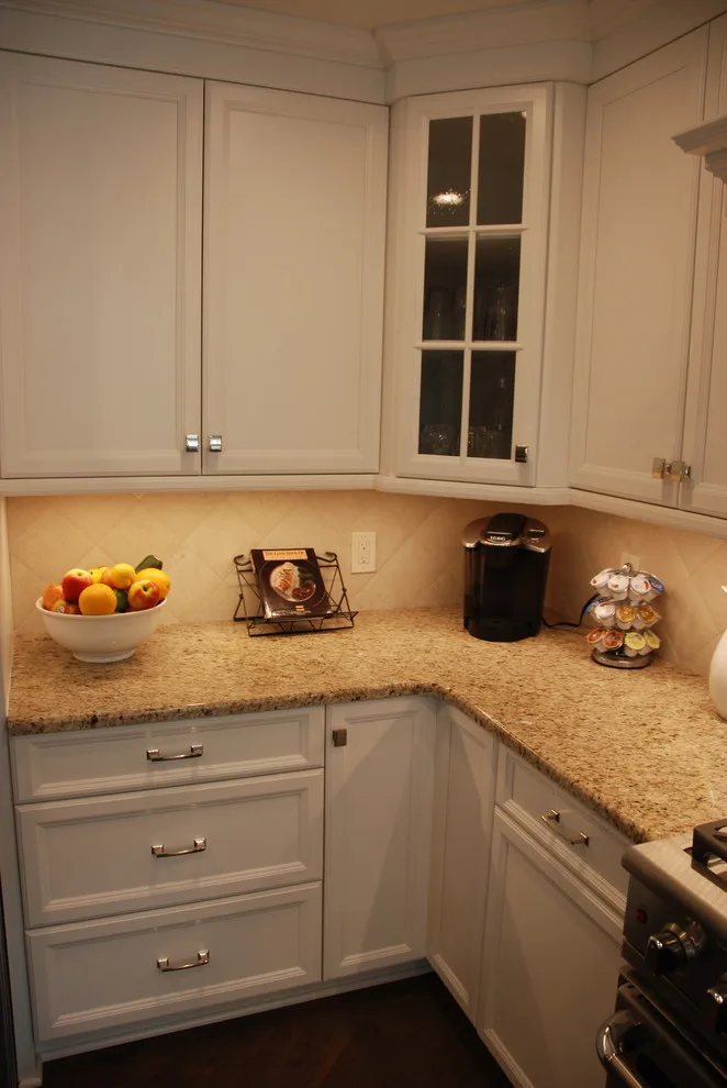 Elegant and Charming White Kitchen by Conrad Kitchen, Bath And Remodeling LLC - Photo 7