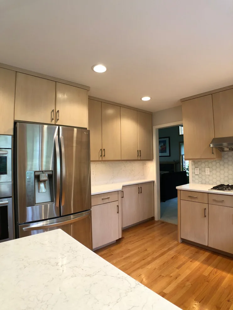 Kitchen Renovation with Glass Tile and Full-Height Quartz Backsplash by D & L Construction - Photo 4