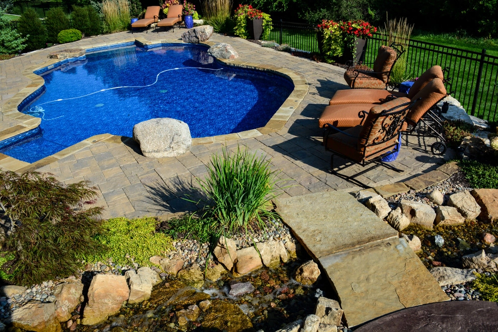 Innovative Pool Patio by Breaking Ground - Photo 12
