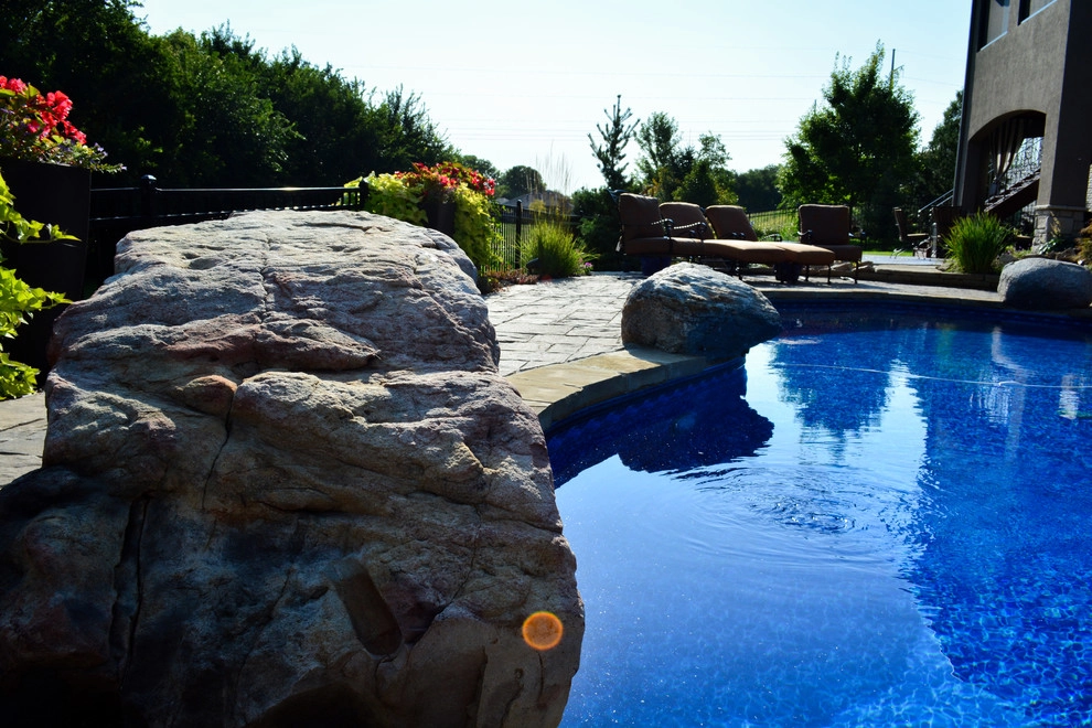 Innovative Pool Patio by Breaking Ground - Photo 38