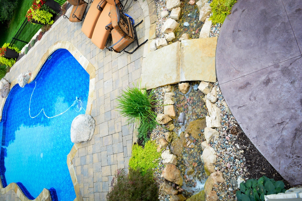 Innovative Pool Patio by Breaking Ground - Photo 28