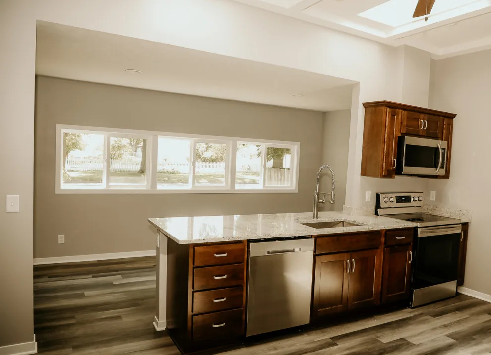 Bright Kitchen with Skylights and Exposed Beams by Paul Davis Restoration-Lincoln - Photo 3
